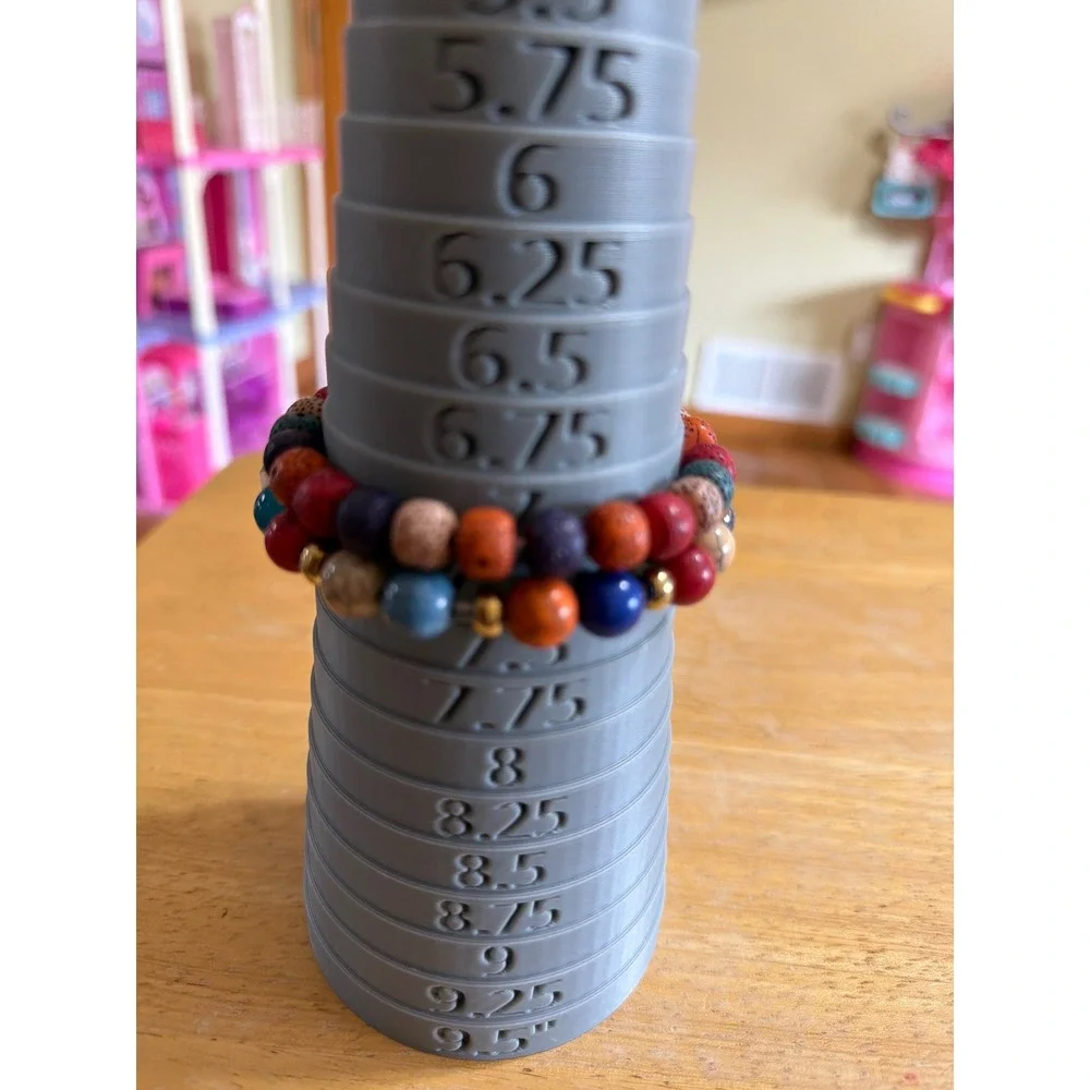 Set of 2 Multi Color Beaded Stretch Bracelets  Silver Wing Charm